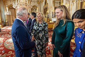 US First Lady Jill Biden, and her granddaughter Finnegan Biden, meet Charles III at a pre-coronation event at Buckingham Palace reception (52874634748).jpg