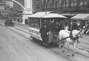 (PD) Photo: Unknown "Rapid Transit in San Diego: 1886 / Original Car and Driver" Panama-California Exposition Ground-breaking parade, 1911.