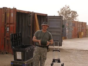 GI loads a shipping container.jpg